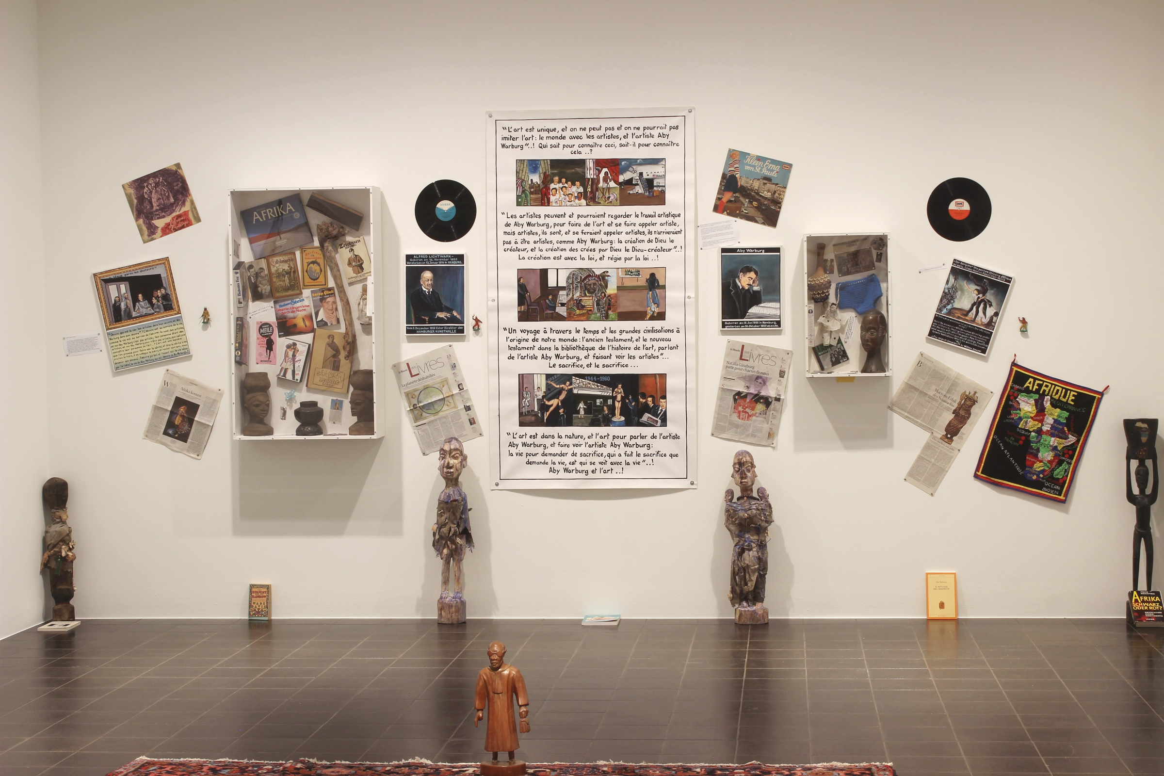 a view of the main wall of Adeagbo's installation at Hamburger Kunsthalle