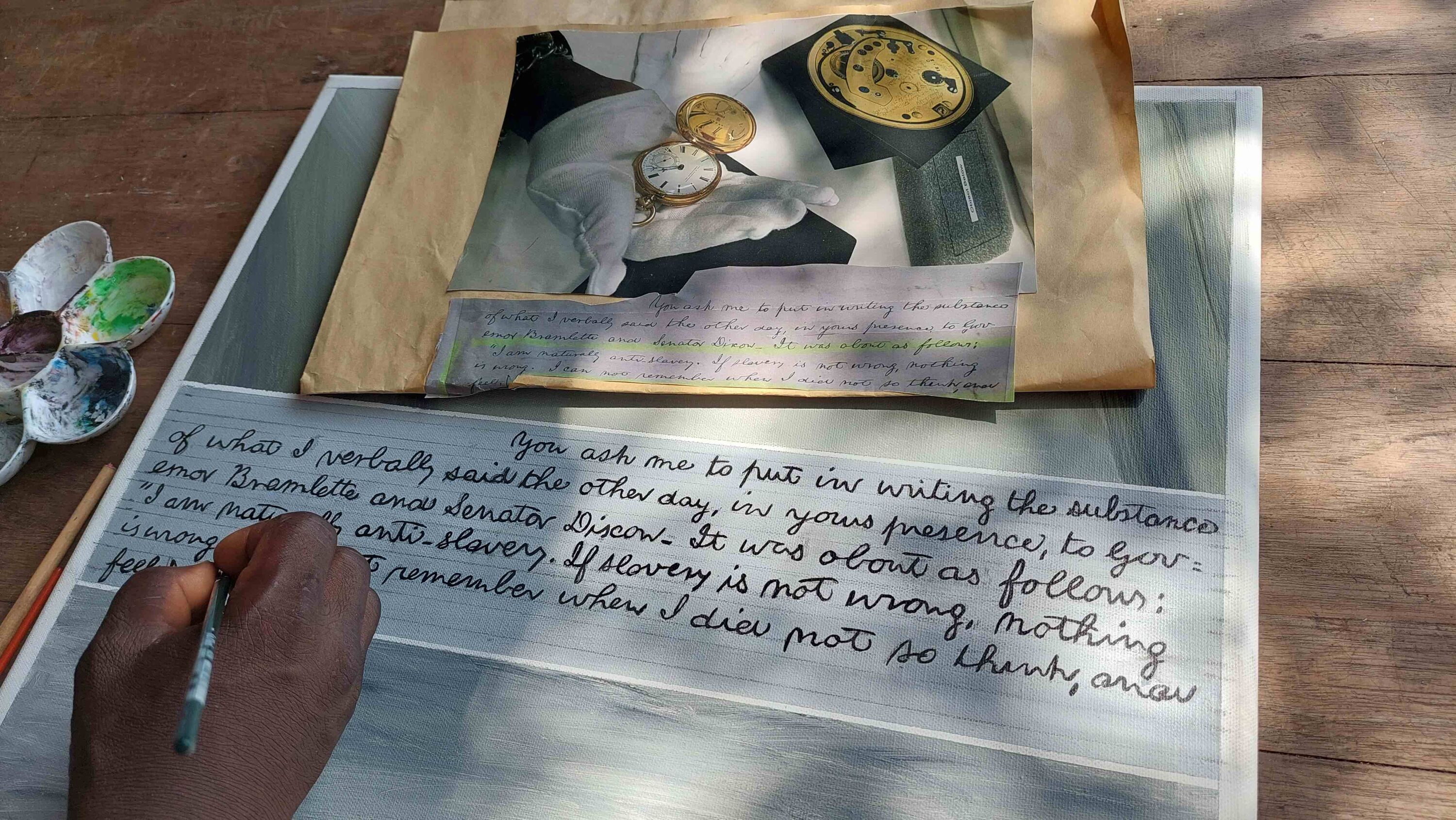 a hand with brush copies a photo of a document of Abraham Lincoln about his disapproval of slavery